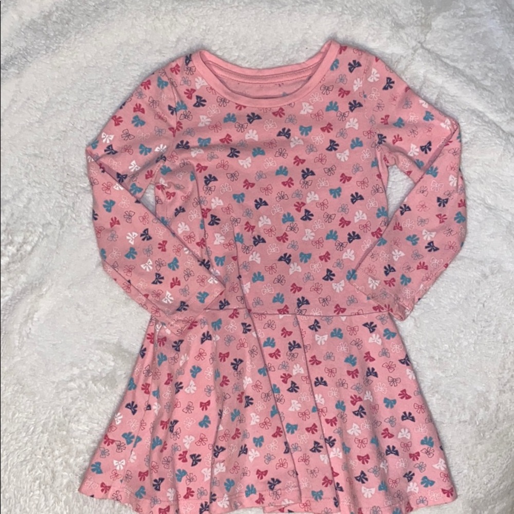 Pink cotton dress with bows.